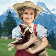 Image montrant la jeune Shirley Temple tenant un chevreau, dans le film Heidi datant de 1937